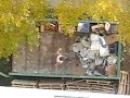 Man Throwing Toilet in Garbage Man Throwing Toilet in Garbage