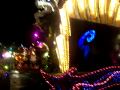 this is the very beginning of the magic kingdom's nighttime light parade, spectromagic. 

this part includes the trumpeteers, the spectromen, the logos, and, of course, mickey mouse.