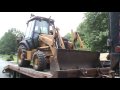 Case 580 loading onto Tag Trailer