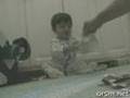 The Baby Laughing at paper