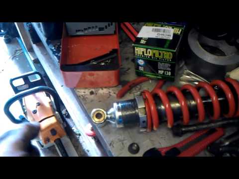 Motorcycle rear shock absorber removal & refit / replace