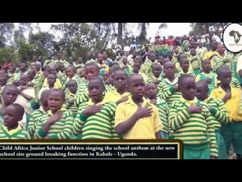 Child Africa Junior school singing the School Anthem at the ground breaking of new School Child Africa Junior school singing the School Anthem at the ground breaking of new School