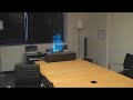 Heliodisplay M30 displaying spinning logo in conference room