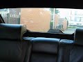 E38 BMW 740i, Automatic folding headrests rear.