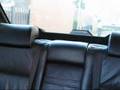 E38 BMW 740i, Automatic folding headrests rear.
