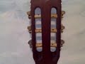 How to put strings on a classical guitar - a close up How to put strings on a classical guitar - a close up
