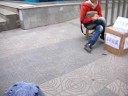 Wuxi Andis pushes his son to the post office in order to mail him off to his parents.