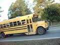 Super boy, big head, and nappy boy dougi n front a bus Super boy, big head, and nappy boy dougi n front a bus