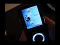 This is a quick walkthrough of the UI on the Sandisk Sansa E250 Version 2 which has been flashed with the latest official firmware.As you can see in the demo, the way it handles podcasts is far from ideal. You'll see Hirsty's Daily Dose only appears in the 'Songs' list, and to find it you have to scroll through.. very tedious.. and that's only with 5-6 albums installed on the device!!All your songs need proper/consistent ID3 tags too; it won't use the folder structure at all. There are no options to browse the folder structure in any way.If only Rockbox worked on the Sansa V2.. that'd make this MP3 really kick @ss. As it stands it's mediocre at best. Come on Sandisk developers.. help the Rockbox devs port it to the V2!!!