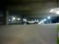 digicam strapped to RC car in parking garage