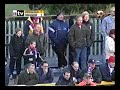 Rushden & Diamonds' Tarkan Mustafa is assaulted by Southport's Dino Maamria, who, thanks to the worst refereeing decision ever only gets booked. Rushden had the last laugh though, winning the game 3-1 on the way to lifting to the 2000/2001 Conference Championship!
