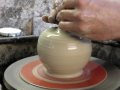 Attempting to make a pottery Apple shaped clay pot on the potters wheel throwing demo