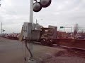 BNSF empty intermodal train with warbonnet and NS SD60