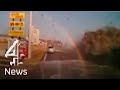 Japan tsunami sweeps car off road in Asahi - driver survives