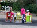 Daniel playing on roundabout in Ballifeary park