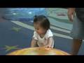 kylee plays on the playground in the mall