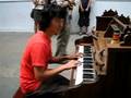 Justin Chun playing the building