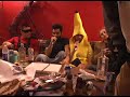 Man in Banana Suit Punching Man Who is Urinating on Table Man in Banana Suit Punching Man Who is Urinating on Table