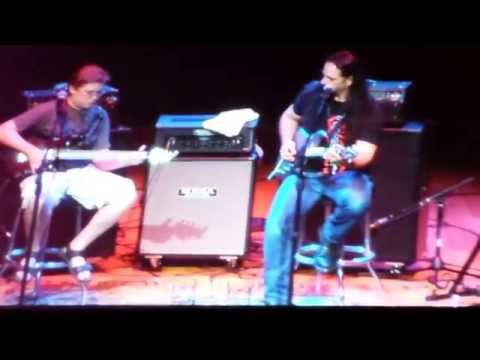 Petrucci - at our clinic at sweetwater...this kid asked if he could play with him and john said sure come on up!!!! tooo cool nice guy too.