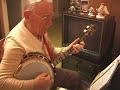 jim robinson (88) tenor banjo, and ruthellen robinson (85) piano, play rose room, at home in kansas city, in 2001 (less)