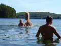 girl swimming with horse