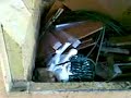 Compactor vs. 8 chipboard plates and other waste