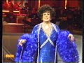 Danny La Rue as Joan Collins