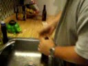 knocking the bottom of a beer bottle O.U.T