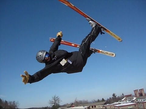SnowboardSecretsTV - Bo Adams of Mountain Guard Insurance takes his work seriously and launches off the kicker to test the inflatable landing pad at Wachusett Mountain, Princeton...