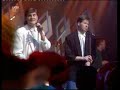 glenn hoddle & chris waddle take a break from football to sing this quasi-industrial pop opus, penned by bob puzey, the genius behind russ abbott's pop career. this single charted at no. 12 in 1987.