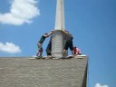 Bringing down the steeple from the new church.