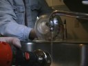 Cutting the glass bottom from a Jim Beam Jeannie bottle
