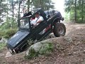 Suzuki Samurai driving down short ledge Suzuki Samurai driving down short ledge