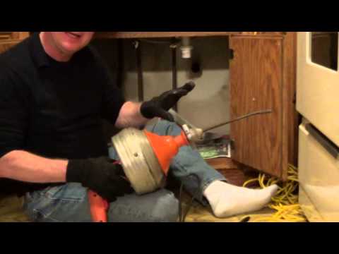 how to use a snake to unclog a tub