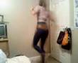 Girl Spinning Around In Circles In Room While Another Girl Watches