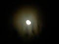 the moon peers out from dark ominous clouds, a red-white halo appears turning into a rainbow around the glowing orb. strange streaks appear on a cloudless morning in the eastern sky...military experiments? you decide.

music: und die flammen, sky cries mary lp
until the grinders cease