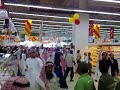 Crowd inside the store around the cake after the minutes after the opening