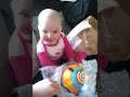 Baby laughing hysterically at popping bubble wrap