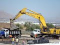 Huge Komatsu PC1250 loading small Sterling dump truck