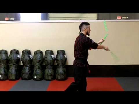 nunchaku - Master Lee demonstrates several nunchaku tricks used in the Double Nunchaku forms.