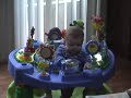 Love at first sight...Connor plays with his his Exersaucer
