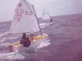 OPTISAILING Lea surfing past Peter Janezic on a reach