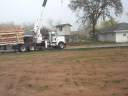 Play house was moved to piers from it's tall perch on stilts with the help of a crane.  Careful placement of the piers and precice cutting og the stilts made this job go smooth.  No leveling was required once it was on the piers.