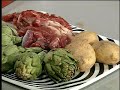 Cordero confitado y asado con alcachofas y patatas
