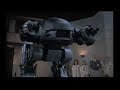 fans of mr kinney rejoice! a malfunctioning ed-209 unit takes out the wrong guy in this robocop re-edit.