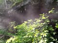 Fog rising from a cave entrance