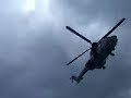 Icelandic coast guard helicopter pulling up man from a boat
