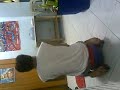 a mongoloid playing his twist car and giving thanz to his dady