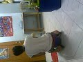 a mongoloid playing his twist car and giving thanz to his dady