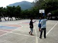 By the sea, on isolated roadside small town of La Ciénaga (pop. 7,715) in Barahona, SouthWest region of the Dominican Republic. No fancy sneakers or uniform required to play here. Actually, most play